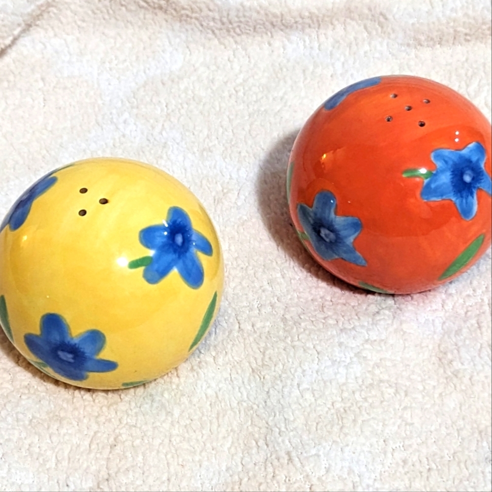 - - Avon Salt and Pepper Shakers. Round painted globe shaped.
